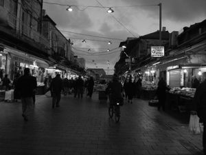 "Shuk at night with bicycle"