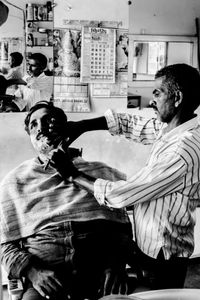 The Barber - Sanjay giving a close shave.