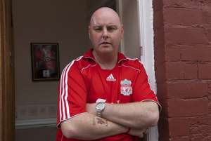 Steven Hoydens, the only red Liverpool supporter in a street full of blue Everton Supporters. Everton, Liverpool 13 May 2007.