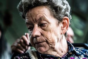 An old woman in a tram.