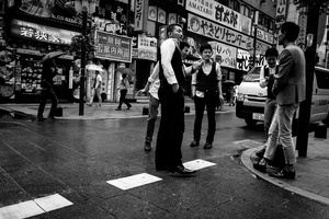 Touts for girl's bar, cabaret, peep-show talk together in the main street of Kabukicho