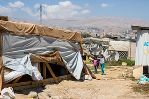 Bekaa Valley, LEBANON, September 5, 2014: Children walk through an informal settlement for Syrian refugees in Lebanon's Bekaa Valley. UNICEF reports that 6.5 million Syrian children have been affected by the Syrian war. 2.8 million children are no longer in school and more than one million are living as refugees in neighboring countries.