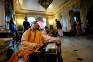A monastic leads kirtan