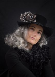 With a flower in her black hat...