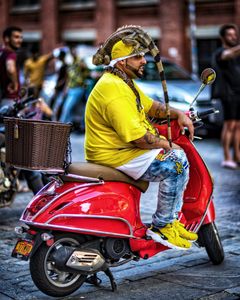 Man With Lizard And Snake Sitting On A Vespa, Brooklyn, NYC