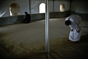 Praying in one of Zaatari's mosques. © Tom Verbruggen
