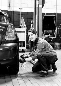 A hip Mini  auto service technician.