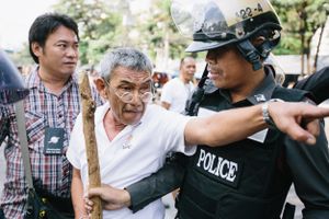 A prospective voter argues with police after being prevented from accessing the ballots by anti-government protesters on election day in Bangkok.