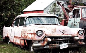 The "Elvis" Cadillac rusted and worn.