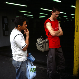 Mourners at the corner of Stockwell Tube station in London the day after the fatal shooting by police of Jean Charles de Menezes suspected of being a terrorist bomber later found to be a case of mistaken identity.