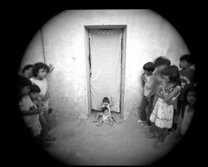 Youngest children pose while others watch