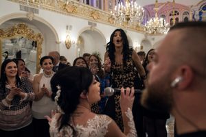 Anthony, famous singer, let the young bride sing the chorus of one of her favorite songs.