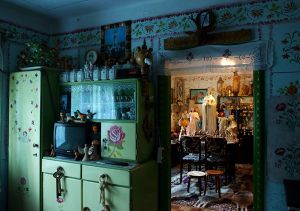 In Mr Benedikt's house. Displaying the self-trained artist's carvings and traditional Romanian wall painting © Dagmar Vyhnalkova