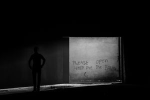 In spring 2016 the Balkan route to western Europe was officially closed, so refugees are stranded in Belgrade. View of inside warehouse at the back of main train station in Belgrade, Serbia.