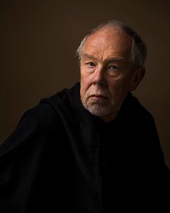 Old man with black cloak