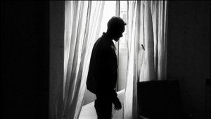 Rome, Italy (2010). Migrant in the once luxurious rooms of the abandoned Somali Embassy.