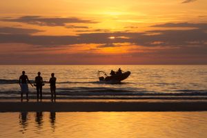 Sunset, people and boat