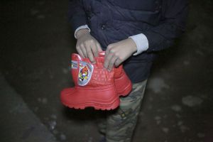 The things Iranian people donate in hands and on feet of children