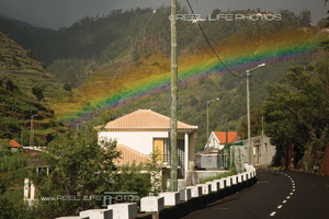 Really wide rainbow over the mountains above Ponta do Sol, Madeira.