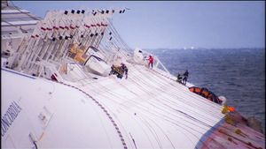 Island of Giglio, Italy (2012). Firemen try to crack the hull of the Costa Concordia wreck and gain access to the ship's interior.