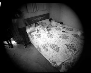 Children sleep on bed