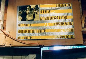 "Flag (Yellow State)" (hand-colored resin-coated photograph, caution tape, duct tape, grommets),