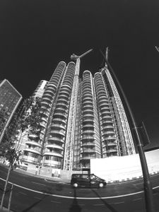 A Cab Passes The Corniche