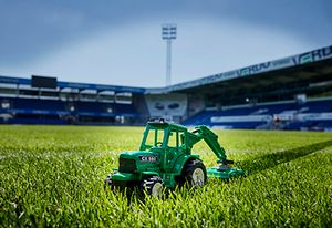 The stadium grass is getting cut