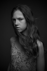 Portrait of a freckled young girl.