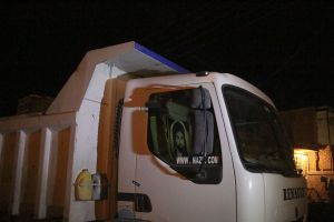 A truck carrying donations and a picture of Muhamad the prophet of muslims that people use his picture often