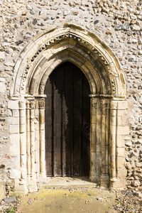 Pillars and chevrons - typical Norman styling on a door at St. Andrew's, Bedingham