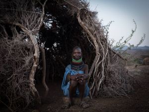 Turkana woman infront of her hut  in northern Kenya