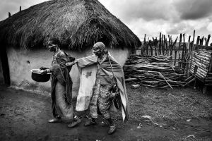 The father Lemaron is trying to stop his wife for a discussion. © Meeri Koutaniemi