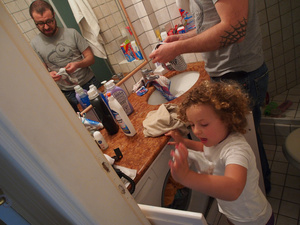 Domenico teaching Margot how to do the laundry