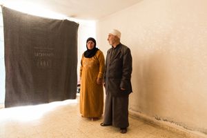 Nasser and Hiba in their new temporary home in Azraq – they didn't want to leave Syria but their children convinced them otherwise when a bombing attack destroyed their home and killed their neighbours. They now live in a basement room with their children's families. © David Brunetti