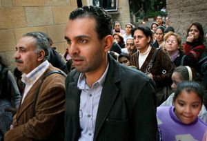 Church go-ers watch the jubilee celebration of a Coptic priest                                                 The Coptic World © Bert Spiertz