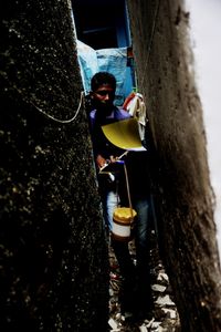 A vaccinator walks through the narrow lane of Antop Hill slums in Mumbai, maharashtra