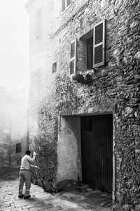 Traditional brooms are used to sweep the Medieval streets