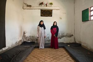 Reem and Noor are sisters in law who share this bare two-room apartment in Azraq with their extended family. The family is struggling to make ends meet and is barely able to afford the rent with the cash assistance and food coupons they receive from UNHCR but they are glad that their young children are now safe. © David Brunetti