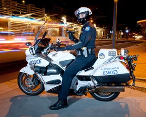 Motor Officer with Radar Gun on Central Avenue