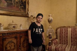 Luciano Ferrara, 8 years old, in the living room of his house in Frignano.