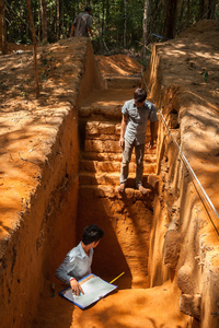 Archeologists work along villagers at ADF’s excavation site in Phnom Kulen. Siem Reap Province, Cambodia.