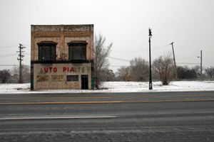© Nicholas Gregory.     The word "Utopia" stands out on an old auto parts store in Corktown, where new businesses have revitalized parts of Detroit's oldest neighborhood.