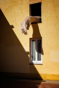 Hand out the window.