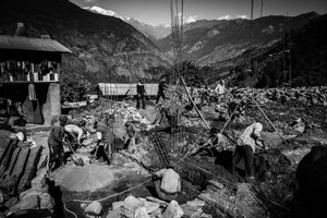 Men rebuilding houses destroyed by the earthquake of April 2015. Mandre, Gorkha District, near the epicenter.