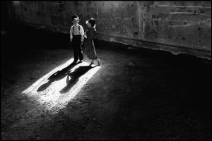 © George Webber - Children in machine shed, 1999