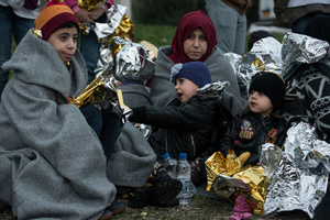 Volunteers and rescuers take care of refugees who landed at the shores of Mytilene, the capital of Lesvos island. March 13, 2016, Lesvos, Greece