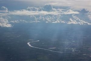 Aerial view of the Cuiaba river that, with its almost 1000 km of extension crosses the capital of Mato Grosso State (of the same name) and connects the region with the south center of the country. After the official statistics of Brazilian Government, Mato Grosso has 40% of its land occupied by extensive beef cattle and is the largest region in soy production of the country.
