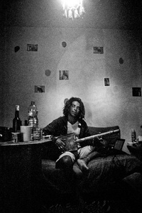Rabi making music in his home in Rabat