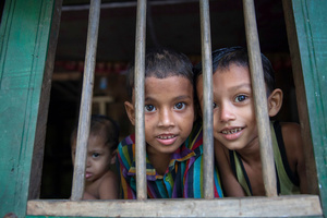 Children look through the window at Morrelganj, Bagerhat, Bangladesh